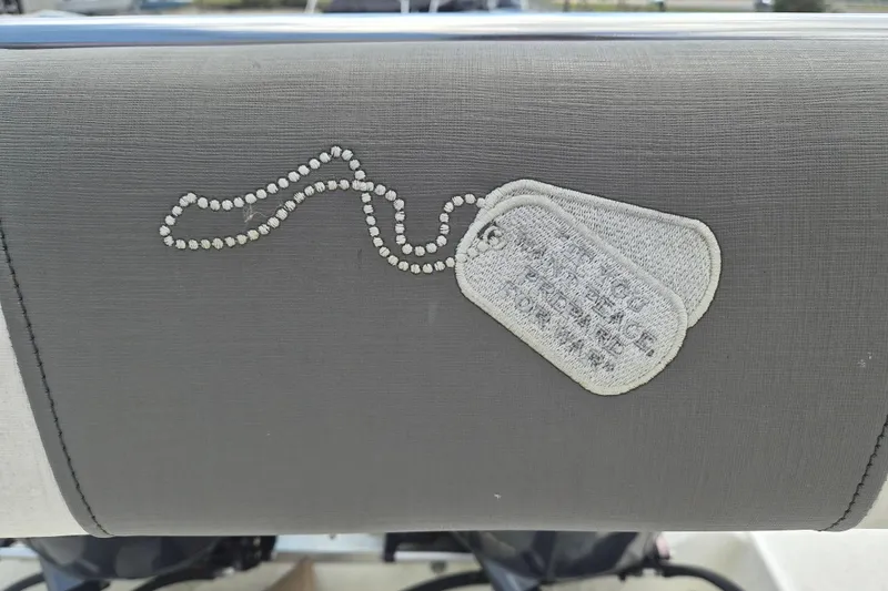 Slide: The Image of Gray boat seat with embroidered dog tags, Century 2900 Center Console, 2006 model. - 5