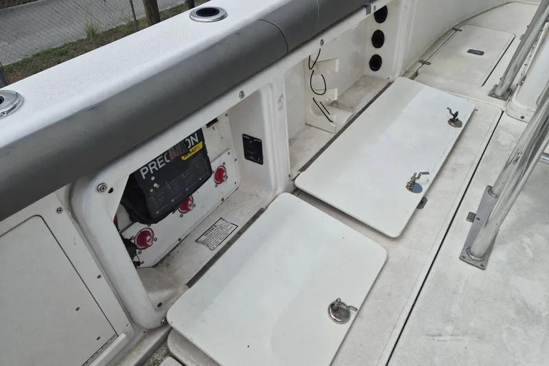 Slide: The Image of 2006 Century 2900 Center Console boat interior with open storage compartments. - 6