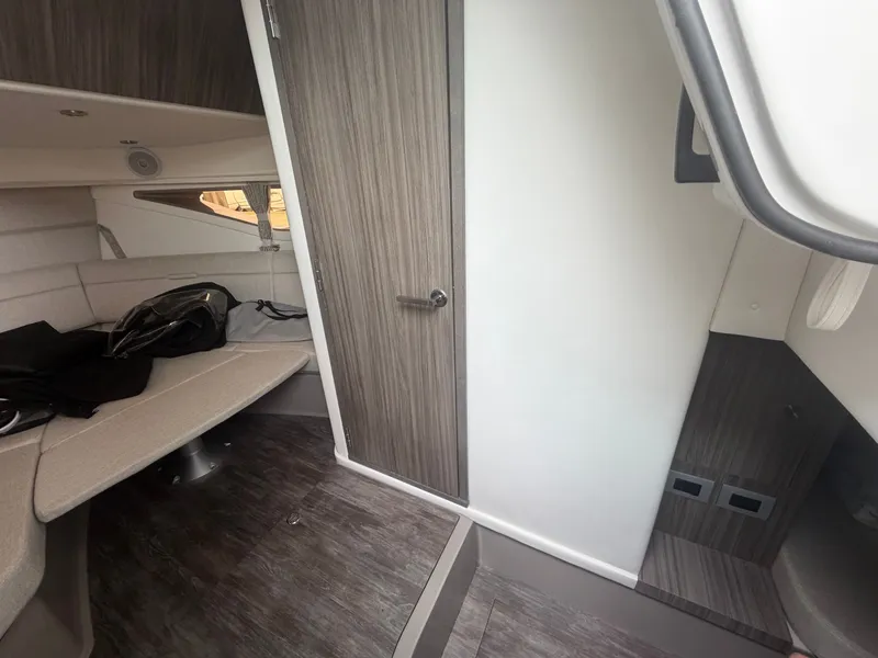 Slide: The Image of Interior of a Sea Ray Sundancer 320 Outboard with modern wood accents and comfortable seating. - 27