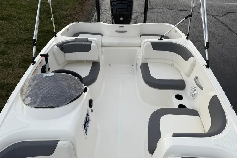Slide: The Image of 2026 Bayliner Element E16 boat interior with gray seating and steering wheel. - 11