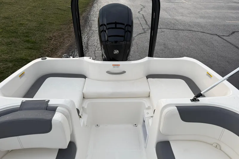 Slide: The Image of 2026 Bayliner Element E16 boat interior with seating and outboard motor. - 15