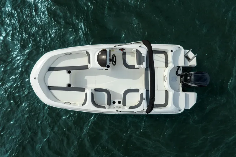 Slide: The Image of Manufacturer Provided Image: 2025 Bayliner Element E16 boat on water, aerial view, sleek design, spacious seating. - 19