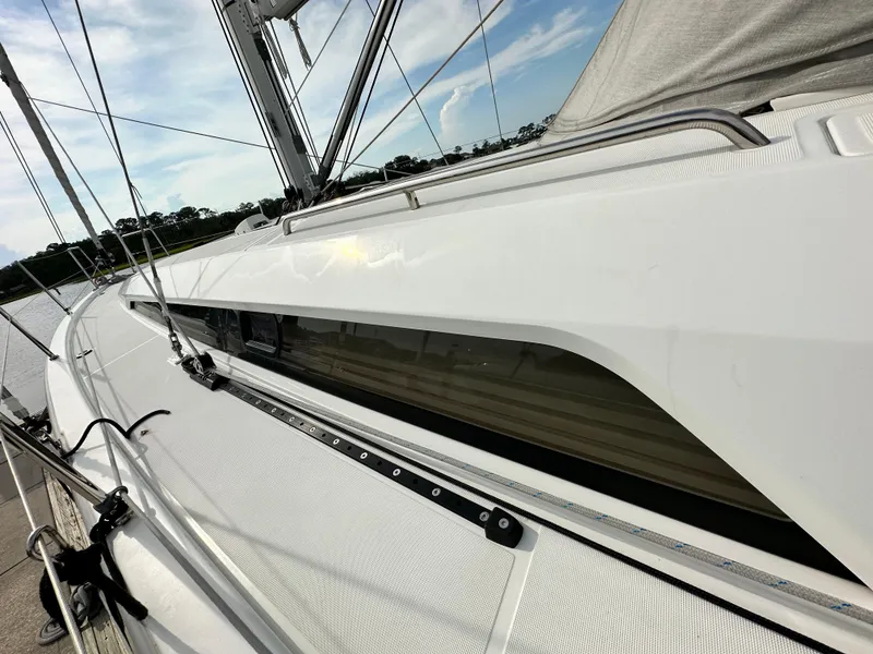 Slide: The Image of 2023 Beneteau Oceanis 46.1 sailboat deck with sleek design and modern rigging. - 16
