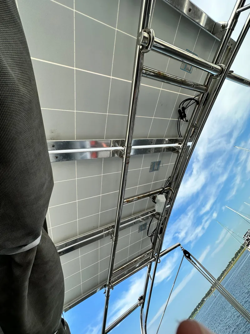 Slide: The Image of Solar panels on a 2023 Beneteau Oceanis 46.1 yacht, with a clear sky background. - 20
