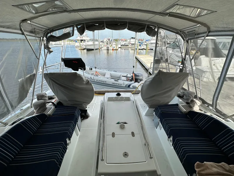 Slide: The Image of Interior view of 2023 Beneteau Oceanis 46.1 yacht with marina backdrop. - 30