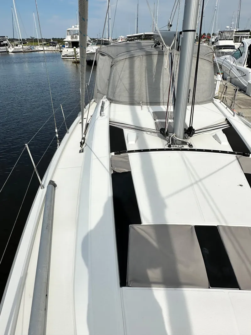 Slide: The Image of 2023 Beneteau Oceanis 46.1 sailboat deck view at marina. - 9