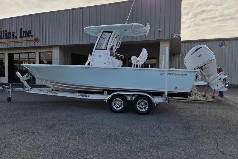 The Image of 2026 Sportsman Masters 247OE Bay Boat on trailer outside dealership. - 0