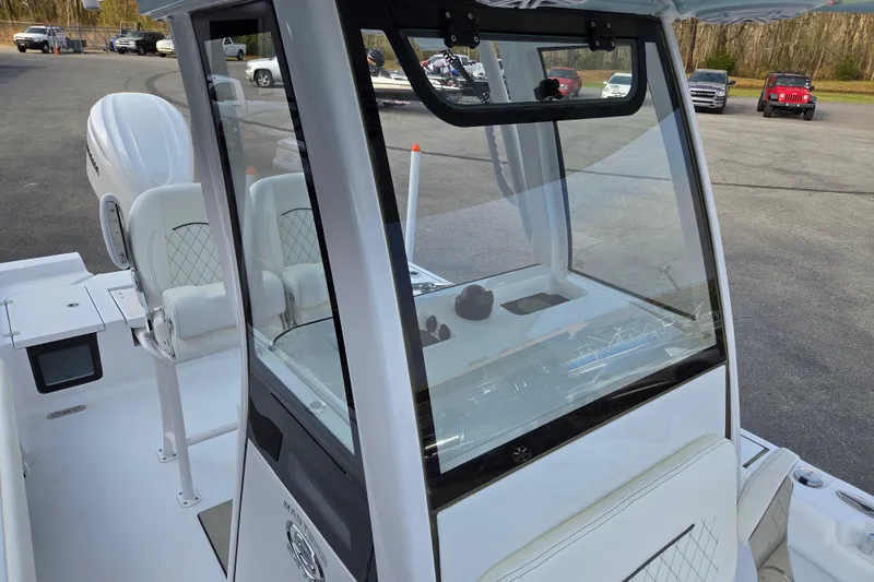 Slide: The Image of 2026 Sportsman Masters 247OE Bay Boat cockpit with modern seating and controls. - 10