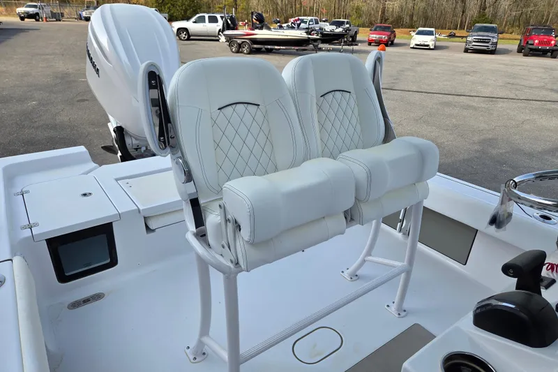 Slide: The Image of 2026 Sportsman Masters 247OE Bay Boat with dual white cushioned seats and sleek design. - 12