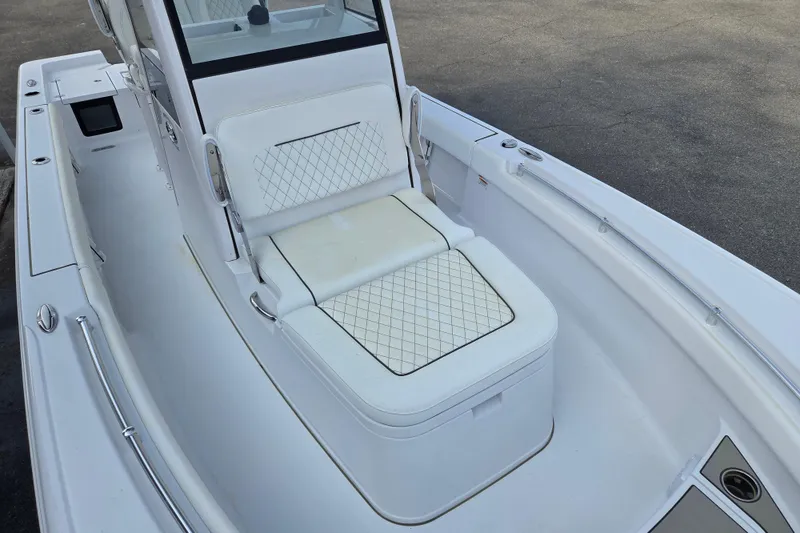 Slide: The Image of 2026 Sportsman Masters 247OE Bay Boat interior with cushioned seating and sleek design. - 8