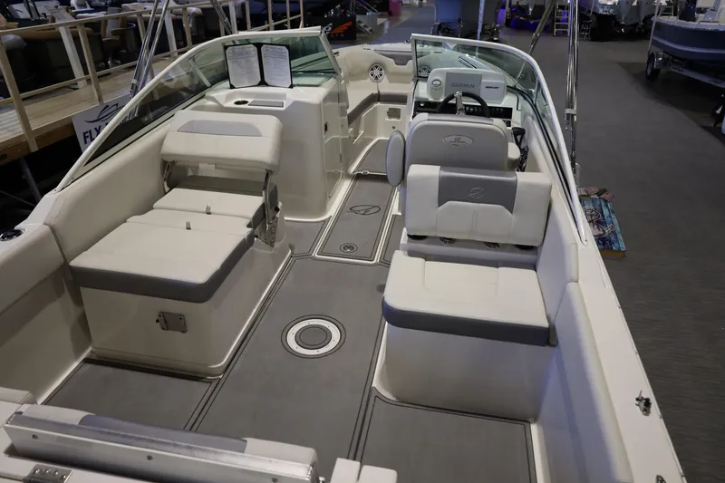 Slide: The Image of 2026 Sailfish 236 DC boat interior with seating and steering console. - 17