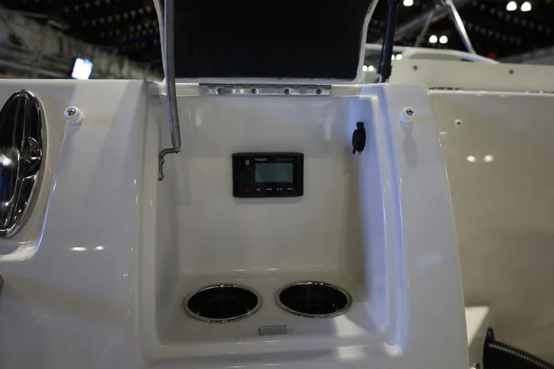 Slide: The Image of Interior view of 2026 Sailfish 236 DC boat featuring a control panel and cup holders. - 19