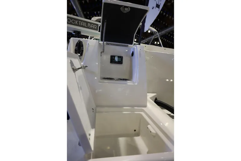 Slide: The Image of Interior view of 2026 Sailfish 236 DC boat, featuring storage compartments and control panel. - 20