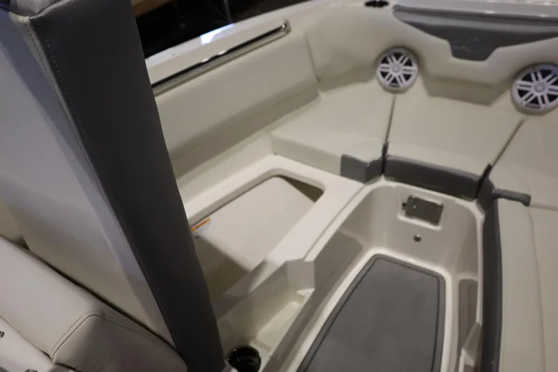 Slide: The Image of Interior view of 2026 Sailfish 236 DC boat, featuring seating and speakers. - 24