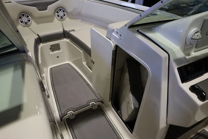 Slide: The Image of 2026 Sailfish 236 DC boat interior with seating and storage compartments. - 26