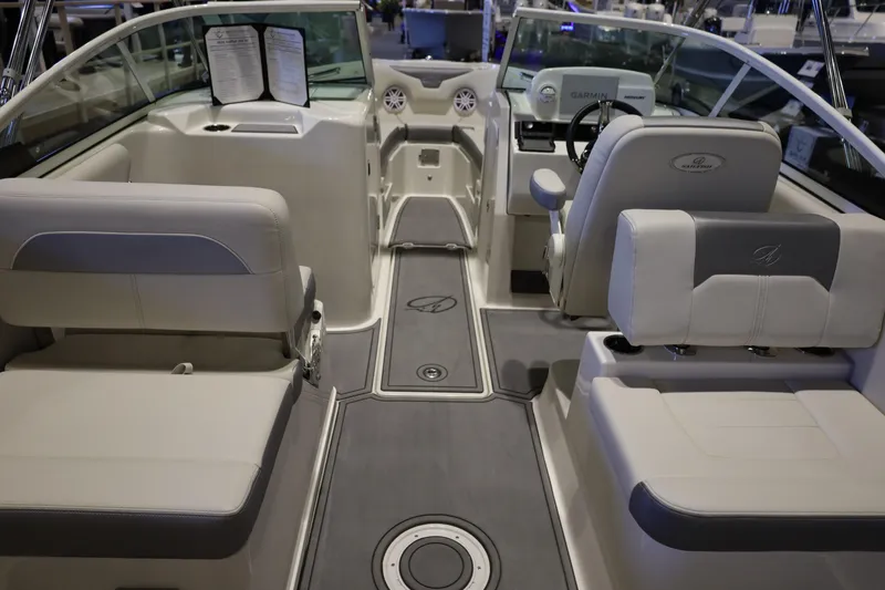 Slide: The Image of 2026 Sailfish 236 DC boat interior with modern seating and steering console. - 34