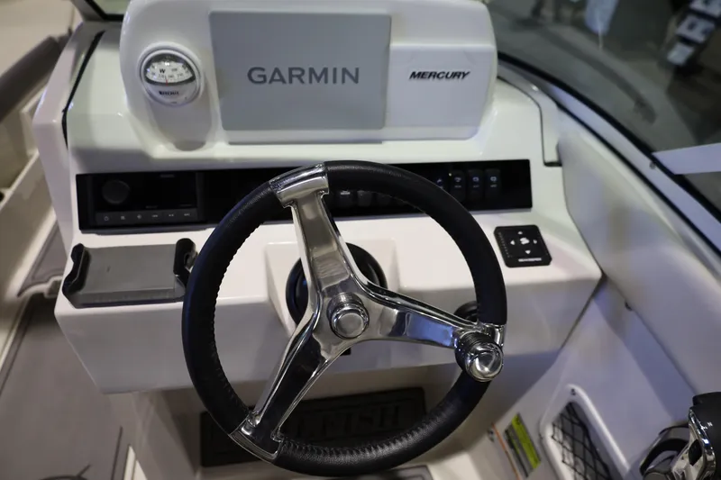 Slide: The Image of Steering console of 2026 Sailfish 236 DC boat with Garmin and Mercury controls. - 8