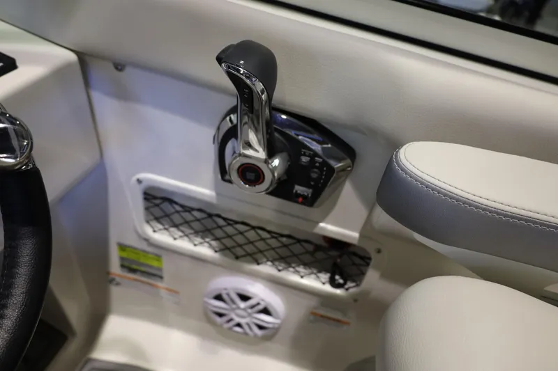 Slide: The Image of 2026 Sailfish 236 DC boat interior with throttle control and speaker detail. - 9