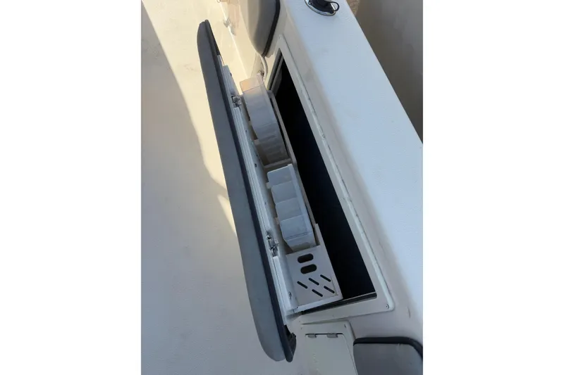 Slide: The Image of Storage compartment on 2023 Sea Chaser 27 HFC CC boat, featuring organized tackle boxes. - 13