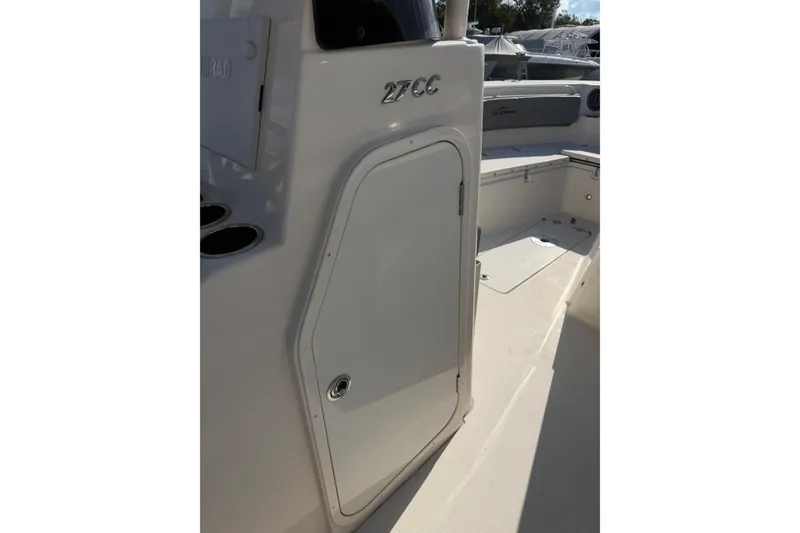 Slide: The Image of 2023 Sea Chaser 27 HFC CC boat interior with storage compartment. - 16