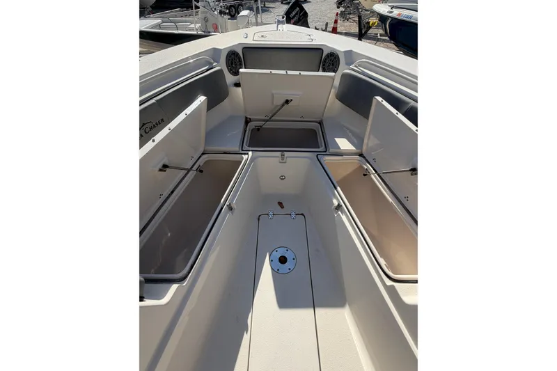 Slide: The Image of 2023 Sea Chaser 27 HFC CC boat interior with open storage compartments. - 18