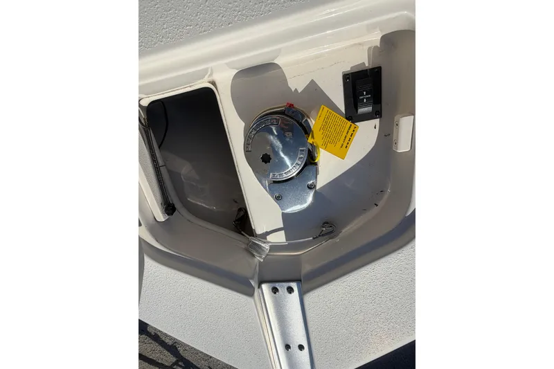 Slide: The Image of 2023 Sea Chaser 27 HFC CC boat fuel compartment with cap and warning label. - 19