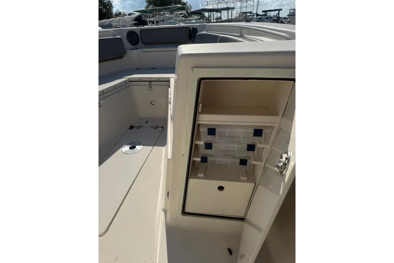 Slide: The Image of 2023 Sea Chaser 27 HFC CC boat interior with storage compartments open. - 21