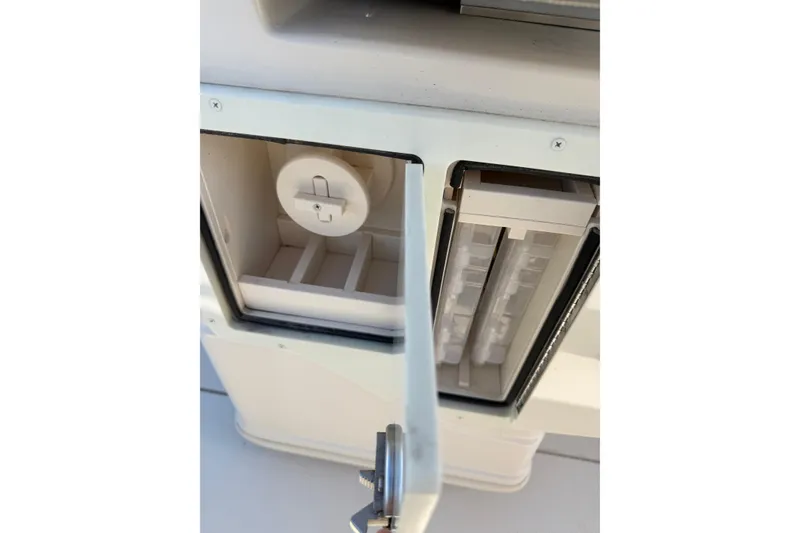 Slide: The Image of 2023 Sea Chaser 27 HFC CC boat compartment with open storage and utility access. - 22