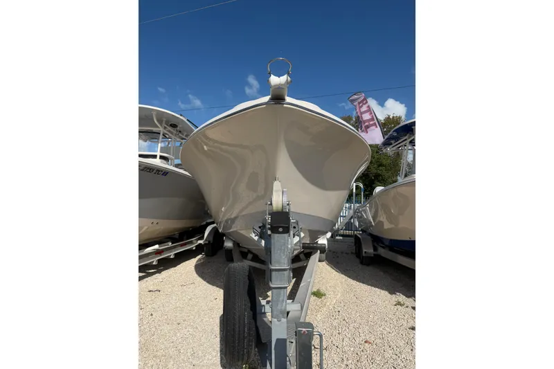 Slide: The Image of 2023 Sea Chaser 27 HFC CC boat on trailer under clear blue sky. - 3