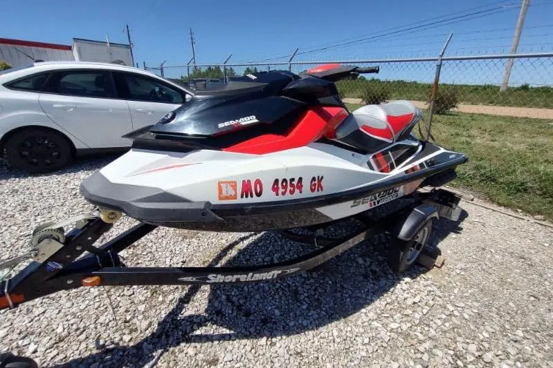 The Image of 2015 Sea-Doo Wake Pro 215 jet ski on trailer, parked outdoors. - 0