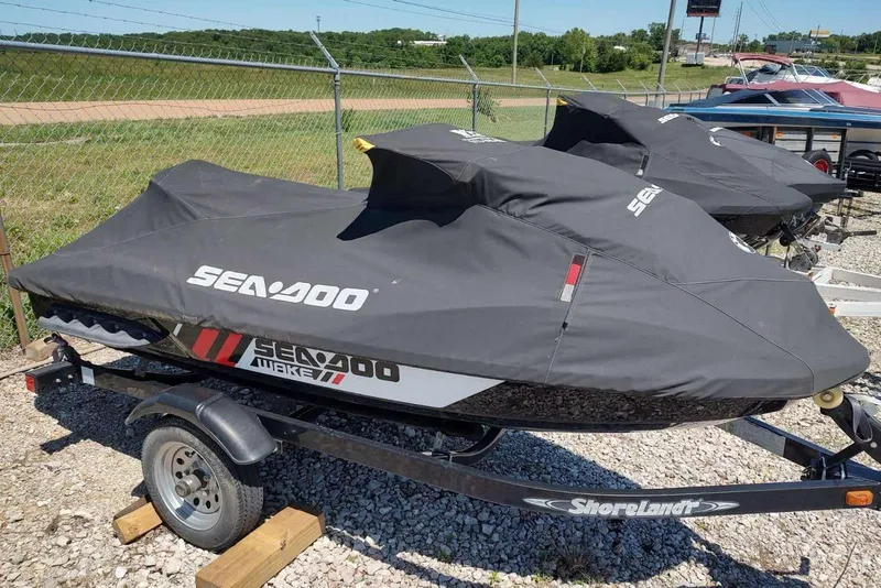 Slide: The Image of 2015 Sea-Doo Wake Pro 215 jet ski covered on trailer, parked outdoors. - 11
