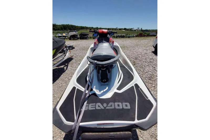 Slide: The Image of 2015 Sea-Doo Wake Pro 215 jet ski parked on gravel lot. - 9