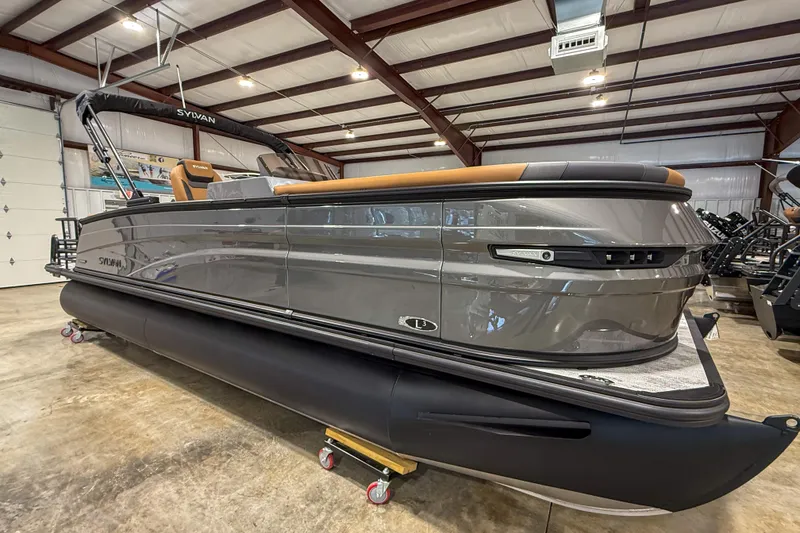 Slide: The Image of 2026 Sylvan L3 LZ DH pontoon boat in a showroom, showcasing sleek design and modern features. - 7