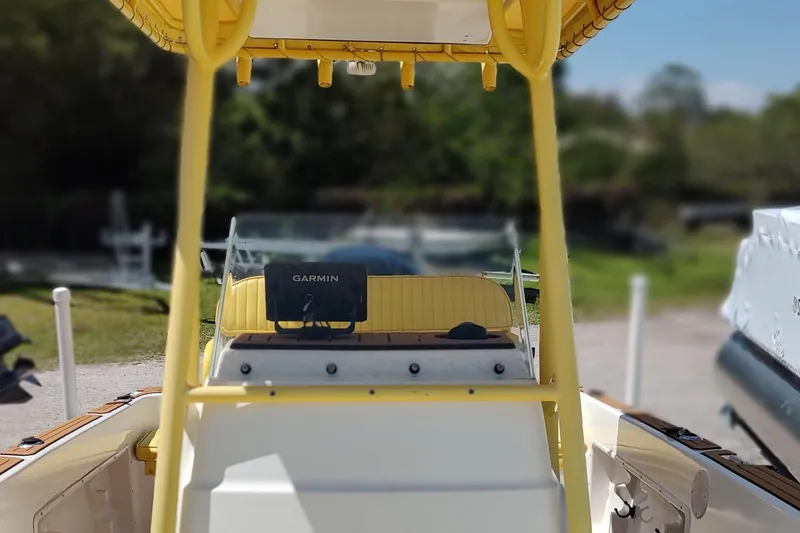 Slide: The Image of 2004 Angler 204 Center Console boat with Garmin navigation system, yellow accents. - 12