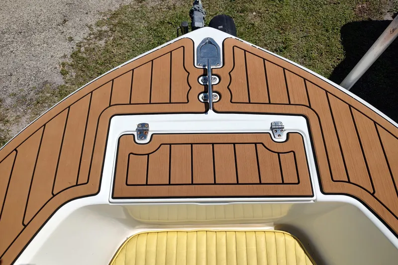 Slide: The Image of Bow deck of 2004 Angler 204 Center Console boat with teak-style flooring. - 5