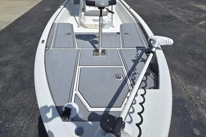 Slide: The Image of 2021 Avid 23 FS boat deck with seating and trolling motor. - 10
