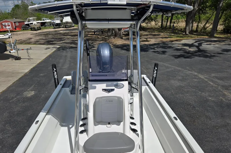 Slide: The Image of 2021 Avid 23 FS boat with Yamaha engine, parked outdoors. - 12