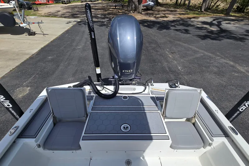 Slide: The Image of 2021 Avid 23 FS boat with 150 HP engine, rear seating, and Power-Pole anchors. - 14