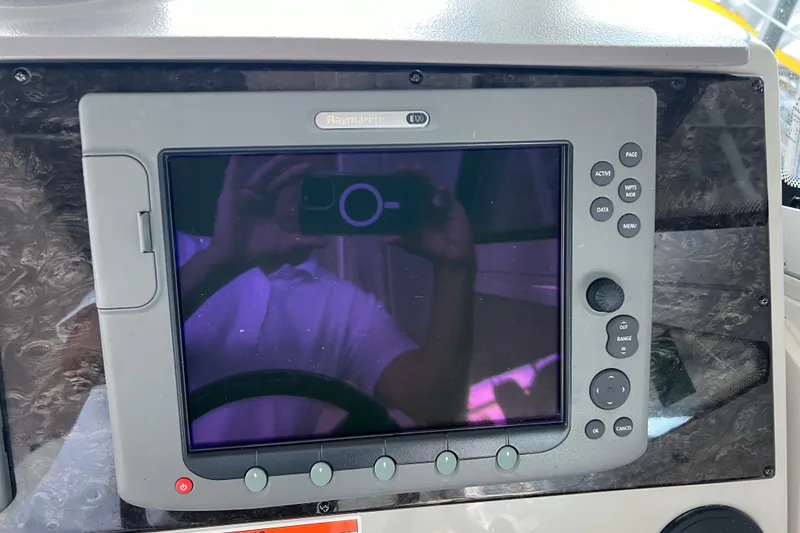 Slide: The Image of Raymarine E120 display on 2009 Searay 470 Sundancer yacht dashboard. - 13