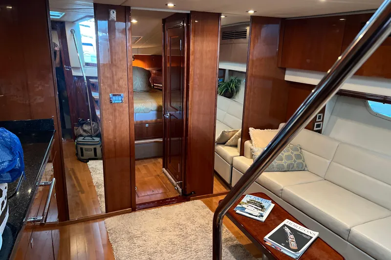 Slide: The Image of Luxurious interior of 2009 Searay 470 Sundancer yacht with elegant wood finishes and plush seating. - 20