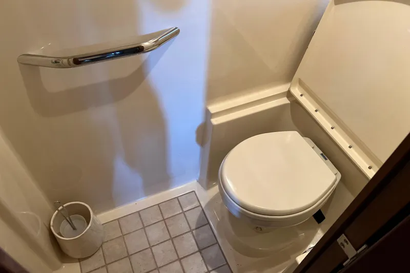 Slide: The Image of Compact bathroom in 2009 Searay 470 Sundancer yacht with toilet and grab bar. - 24