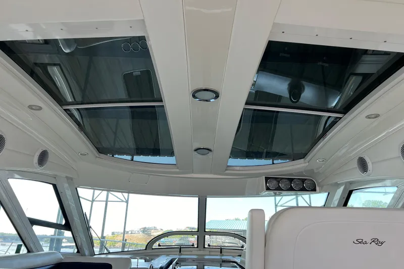Slide: The Image of Interior view of 2009 Searay 470 Sundancer yacht with panoramic windows and sleek design. - 28