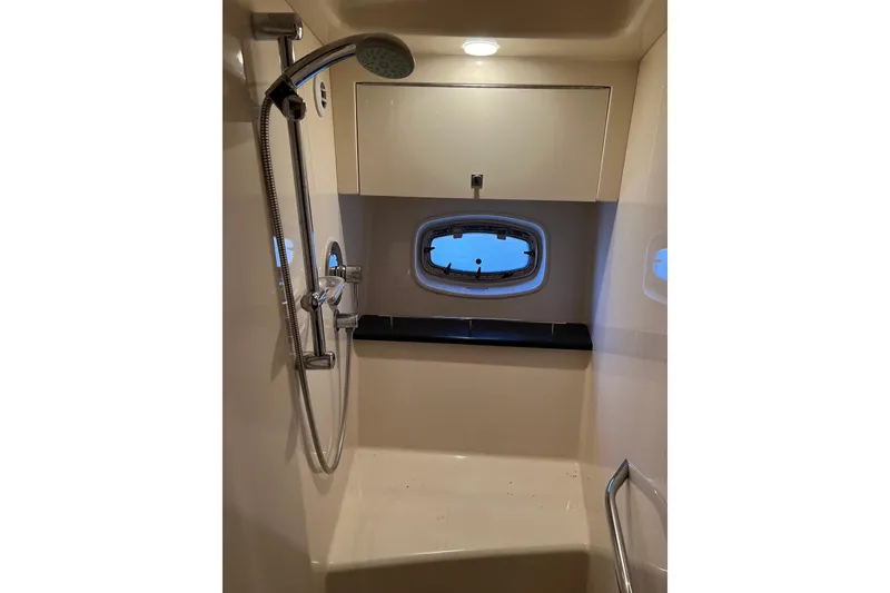 Slide: The Image of Shower area in 2009 Searay 470 Sundancer yacht with window and modern fixtures. - 29