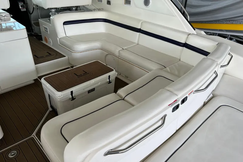Slide: The Image of Luxurious seating area on 2009 Searay 470 Sundancer yacht with white upholstery. - 5
