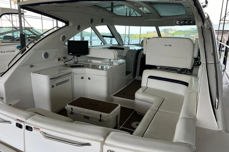Slide: The Image of Luxurious interior of 2009 Searay 470 Sundancer yacht with white seating and modern amenities. - 8
