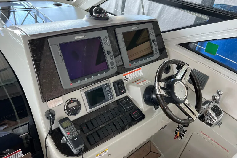 Slide: The Image of Control panel of a 2009 Searay 470 Sundancer yacht with navigation equipment. - 9