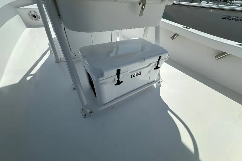 Slide: The Image of White Yeti cooler on 2018 Intruder 23 boat deck, under seat. - 13