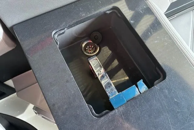 Slide: The Image of Luxurious seating area on a 2022 Cobalt R8 Outboard boat, featuring sleek design and speakers. - 10