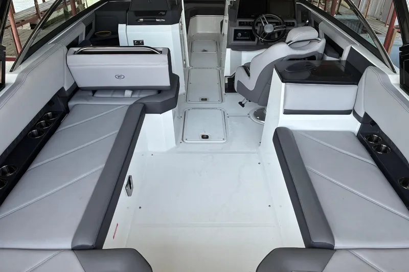 Slide: The Image of 2022 Cobalt R8 Outboard boat interior with sleek gray seating and modern design. - 12