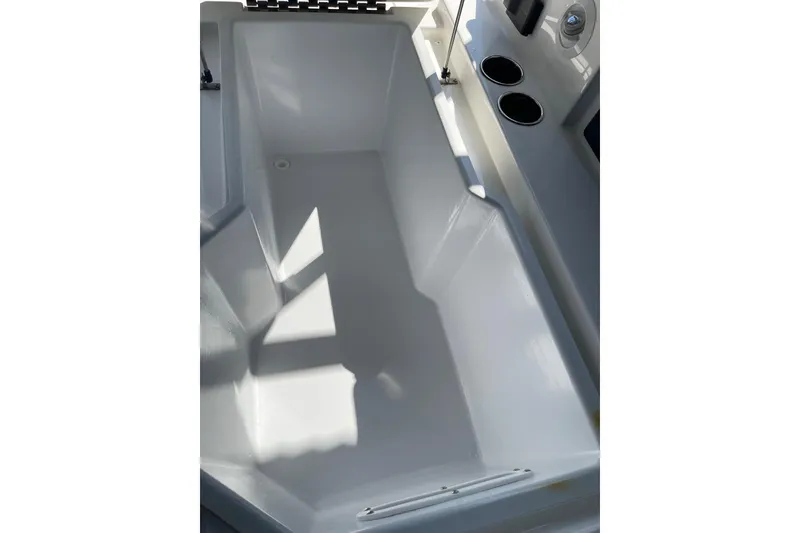 Slide: The Image of Interior of 2022 Cobalt R8 Outboard boat with cup holders and storage compartment. - 14